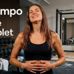 Vignette Guide Complet Tempo Airdrop avec une femme coach de sport en débardeur noir sur fond de salle de musculation futuriste et le logo Tempo.